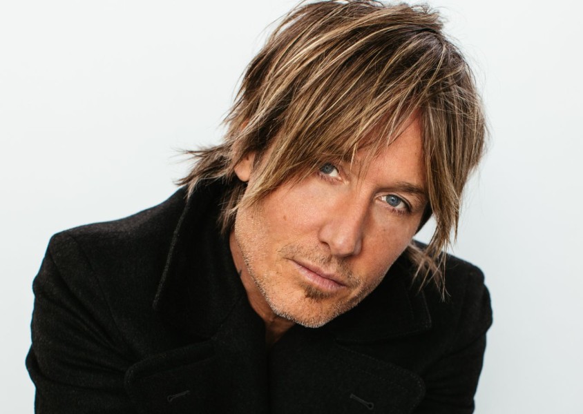 A close up image of Keith Urban wearing a black jacketx
